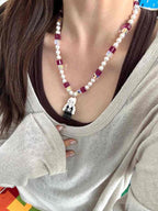 Model wearing handmade pastel crystal charm necklace with Swarovski beads and pearls