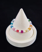 Model wearing handmade rainbow Swarovski crystal cube and pearl bracelet - beaded jewelry