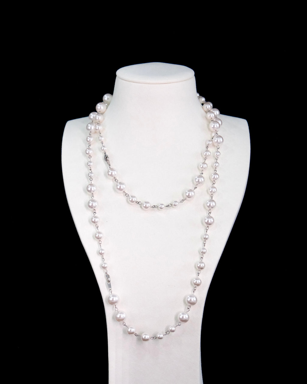 Model wearing handmade long Swarovski pearl necklace - elegant opera length pearl jewelry