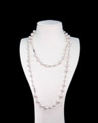 Model wearing handmade long Swarovski pearl necklace - elegant opera length pearl jewelry