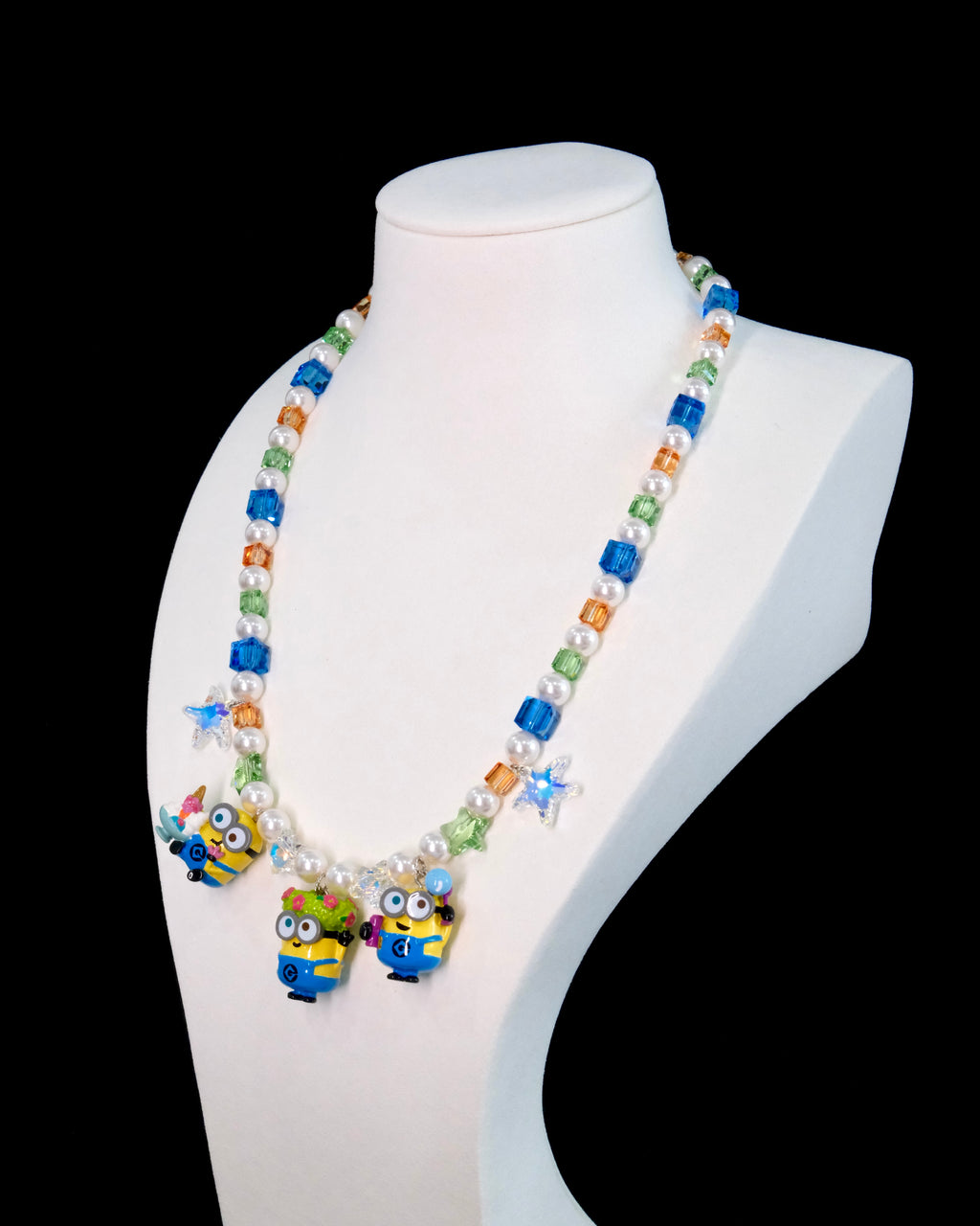 Swarovski crystal beads and pearls close-up on handmade yellow charm necklace by ShinoraStudio