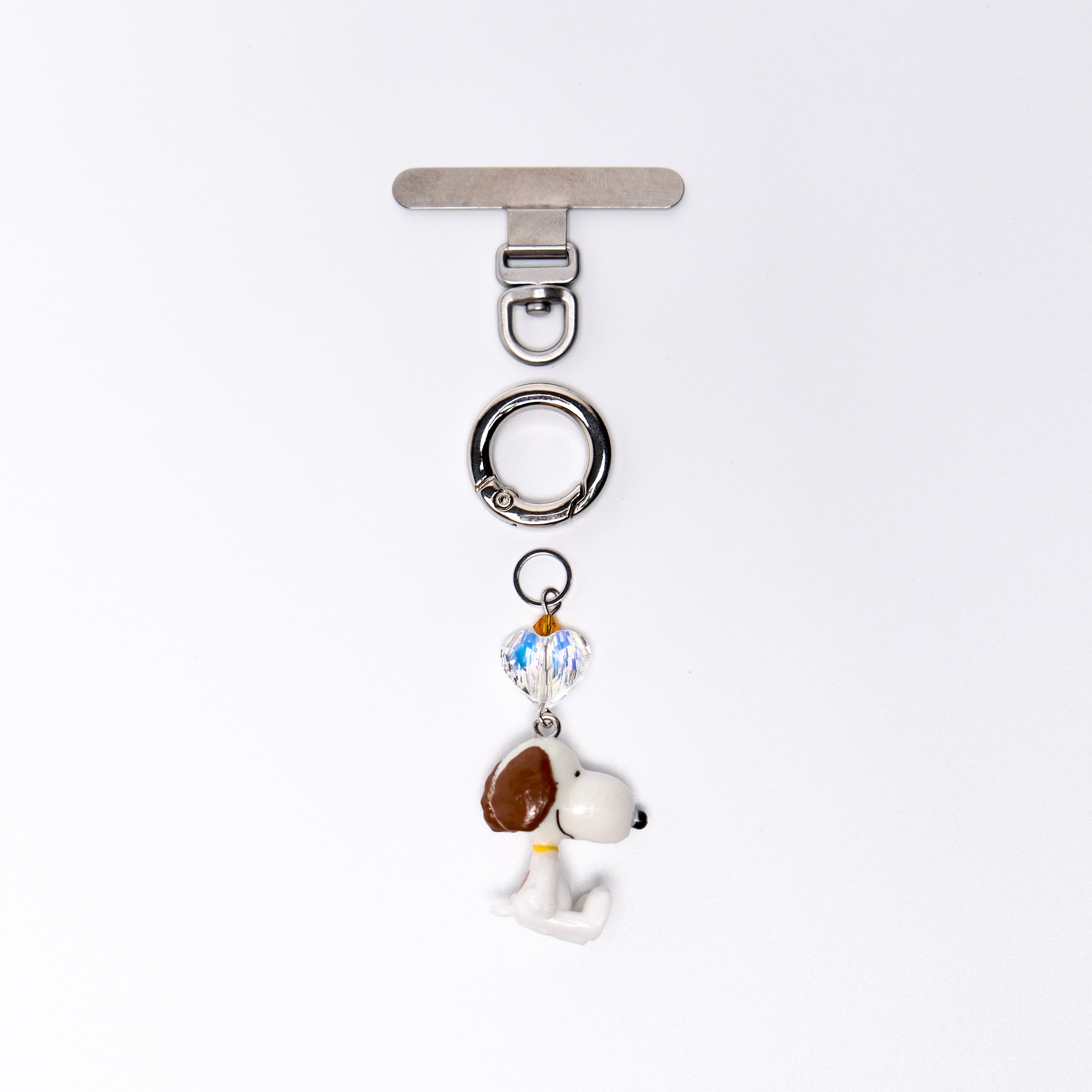 Product photo showing Vintage dog-inspired phone charm with a Swarovski crystal heart and silver-tone phone hardware.