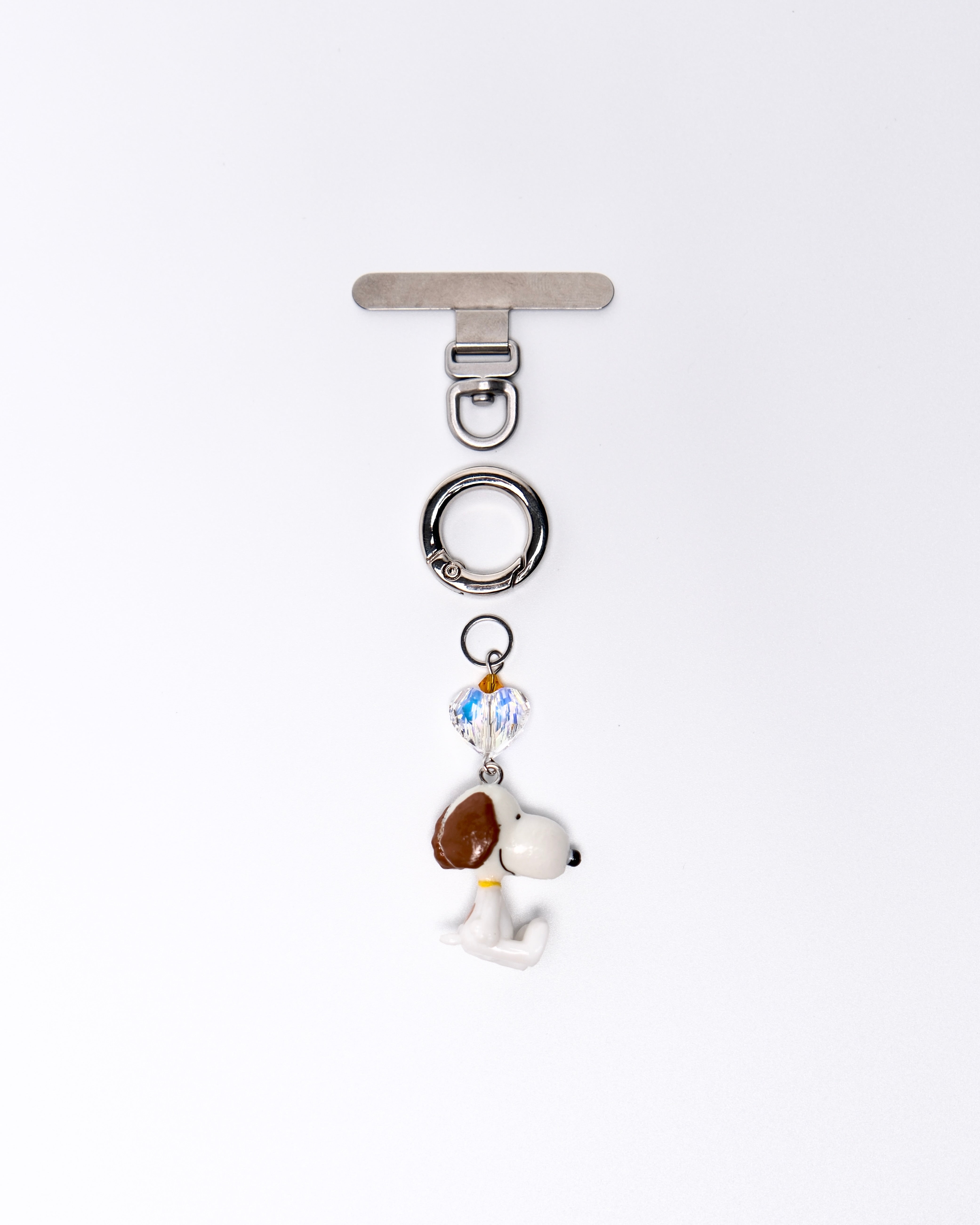 Product photo showing Vintage dog-inspired phone charm with a Swarovski crystal heart and silver-tone phone hardware.