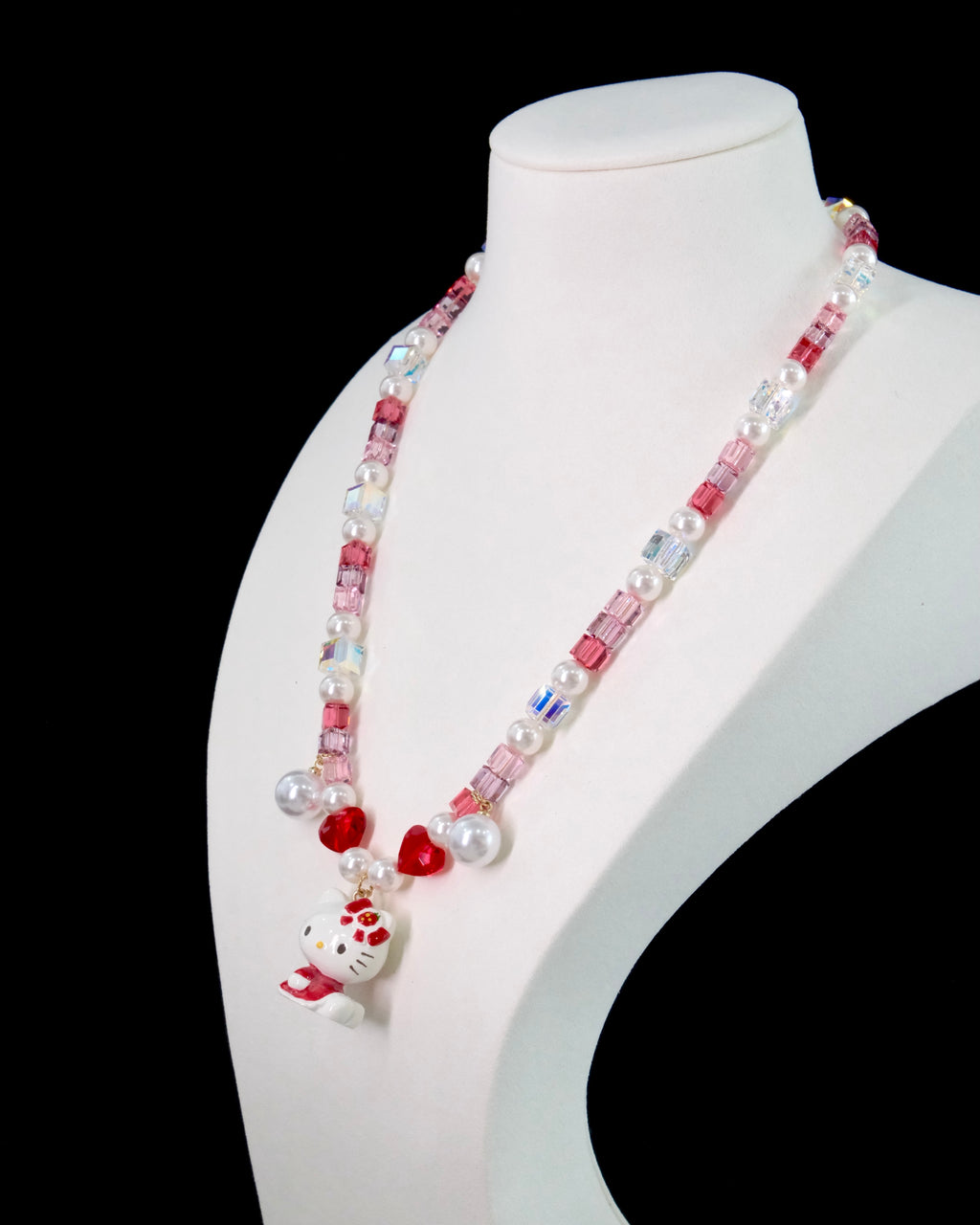 Model wearing handmade pink crystal charm necklace with ruby Swarovski beads and pearls