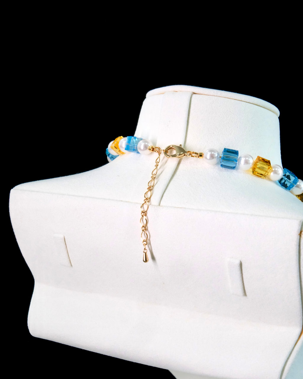 Swarovski crystal beads close-up on handmade multicolor charm necklace - beaded jewelry