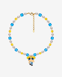 Necklace with blue and yellow Swarovski crystals, white crystal pearls and a blonde girl charm with pigtails and a blue dress.