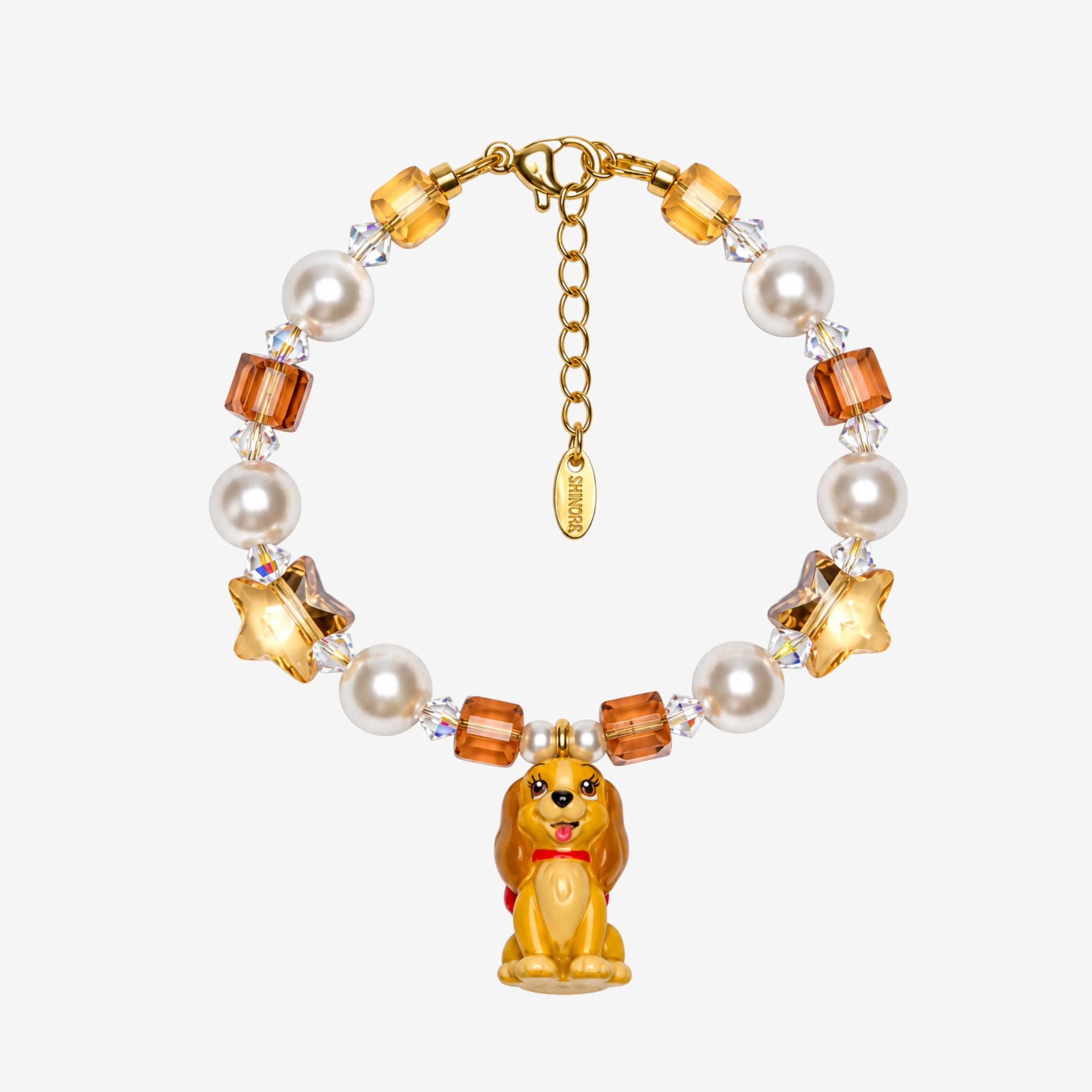 Golden Star Pup Charm Bracelet with amber faceted beads, cream pearl-style beads, gold stars and a brown dog charm.
