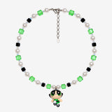 Necklace with green and black Swarovski crystals, white crystal pearls and a green-eyed girl charm wearing a green dress.