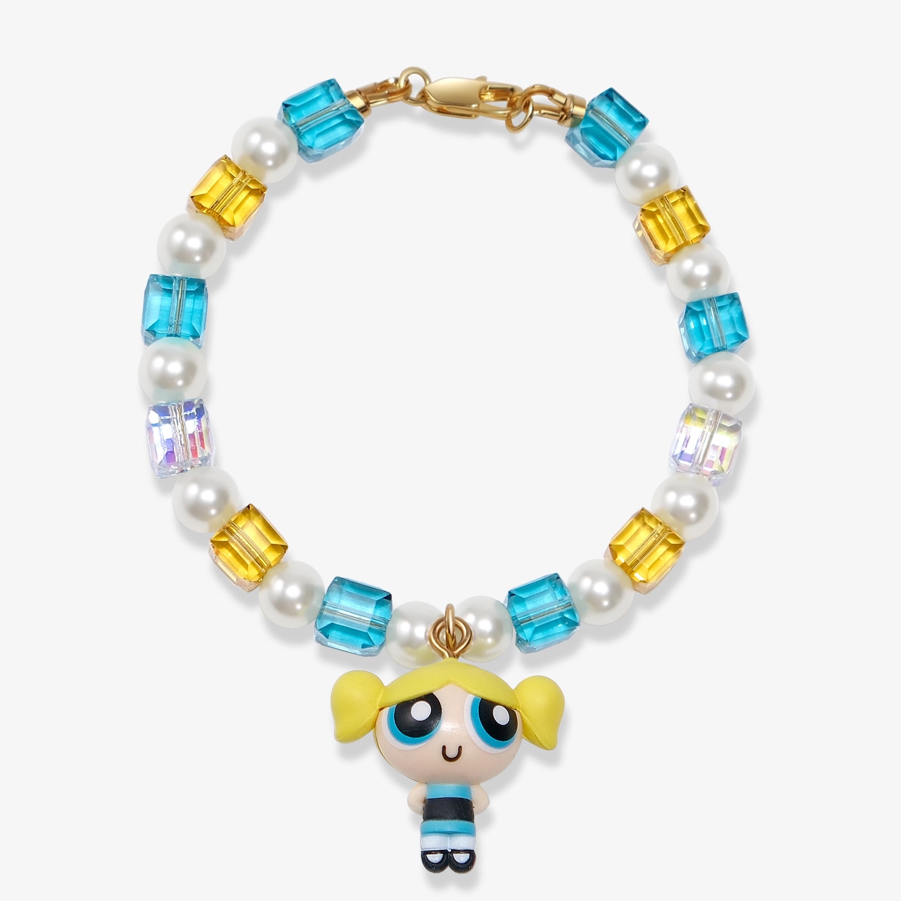 Flat lay of a handmade blue Swarovski crystal charm bracelet with crystals, pearls and nostalgic vintage-inspired collectible charm details