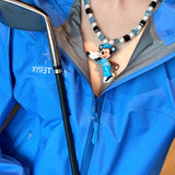 Close-up of a handmade blue Swarovski crystal charm necklace with crystals, pearls and sport-inspired collectible charm details