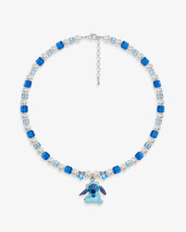 Close-up of a handmade blue Swarovski crystal charm necklace with crystals, pearls and cosmic-inspired collectible charm details