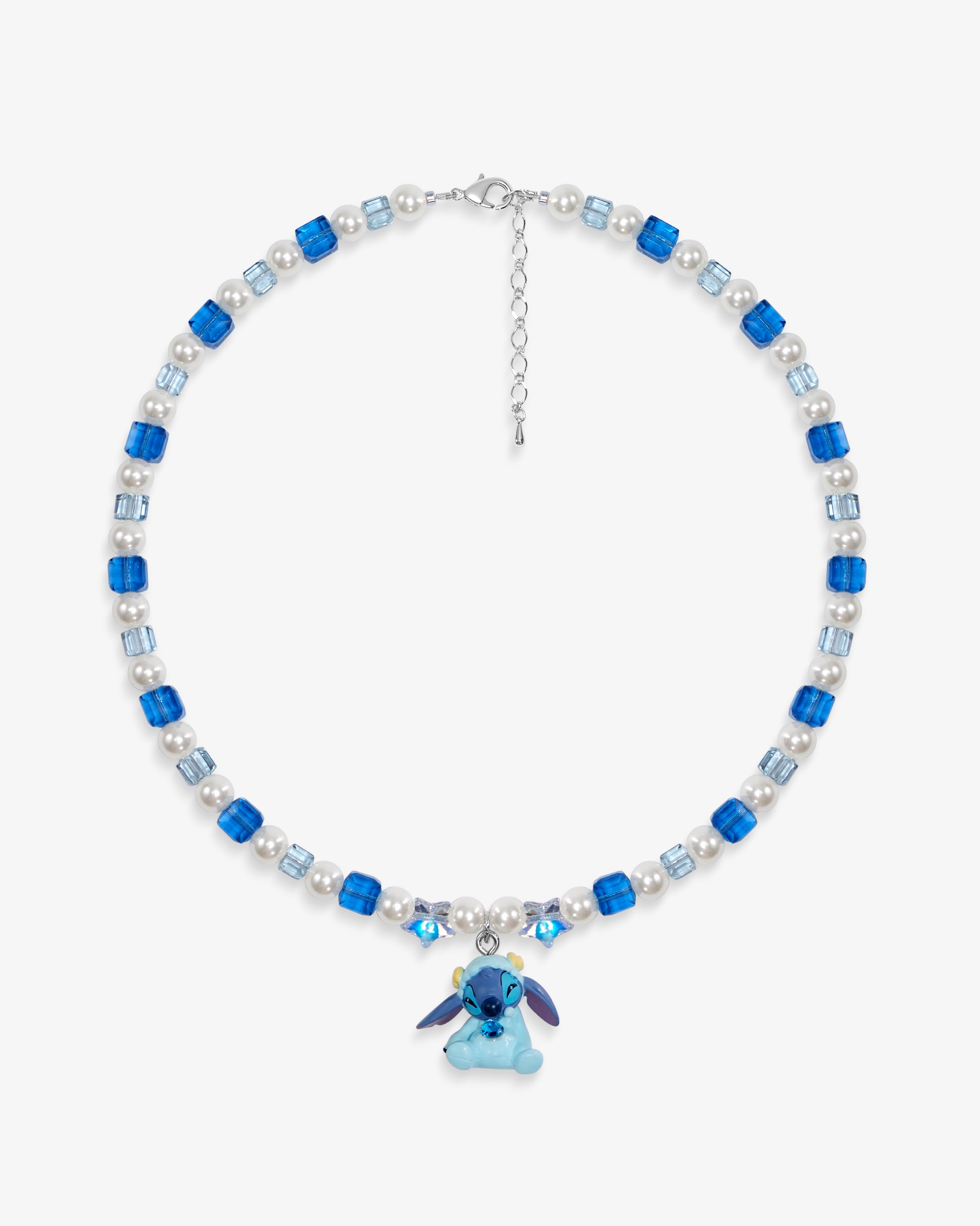 Close-up of a handmade blue Swarovski crystal charm necklace with crystals, pearls and cosmic-inspired collectible charm details