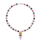 Close-up of a handmade dark Swarovski crystal charm necklace with crystals, pearls and city-inspired collectible charm details