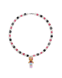 Close-up of a handmade dark Swarovski crystal charm necklace with crystals, pearls and city-inspired collectible charm details