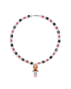 Close-up of a handmade dark Swarovski crystal charm necklace with crystals, pearls and city-inspired collectible charm details
