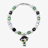 Close-up of a handmade green Swarovski crystal charm bracelet with crystals, pearls and nostalgic vintage-inspired collectible charm details