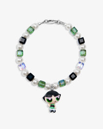 Close-up of a handmade green Swarovski crystal charm bracelet with crystals, pearls and nostalgic vintage-inspired collectible charm details