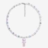 Close-up of a handmade iridescent Swarovski crystal charm necklace with crystals, pearls and sport-inspired collectible charm details
