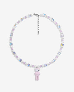 Close-up of a handmade iridescent Swarovski crystal charm necklace with crystals, pearls and sport-inspired collectible charm details