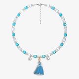 Close-up of a handmade midnight Swarovski crystal charm necklace with crystals, pearls and princess-inspired collectible charm details