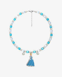Close-up of a handmade midnight Swarovski crystal charm necklace with crystals, pearls and princess-inspired collectible charm details