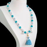 Model wearing a handmade midnight Swarovski crystal charm necklace with crystals, pearls and princess-inspired collectible charm details