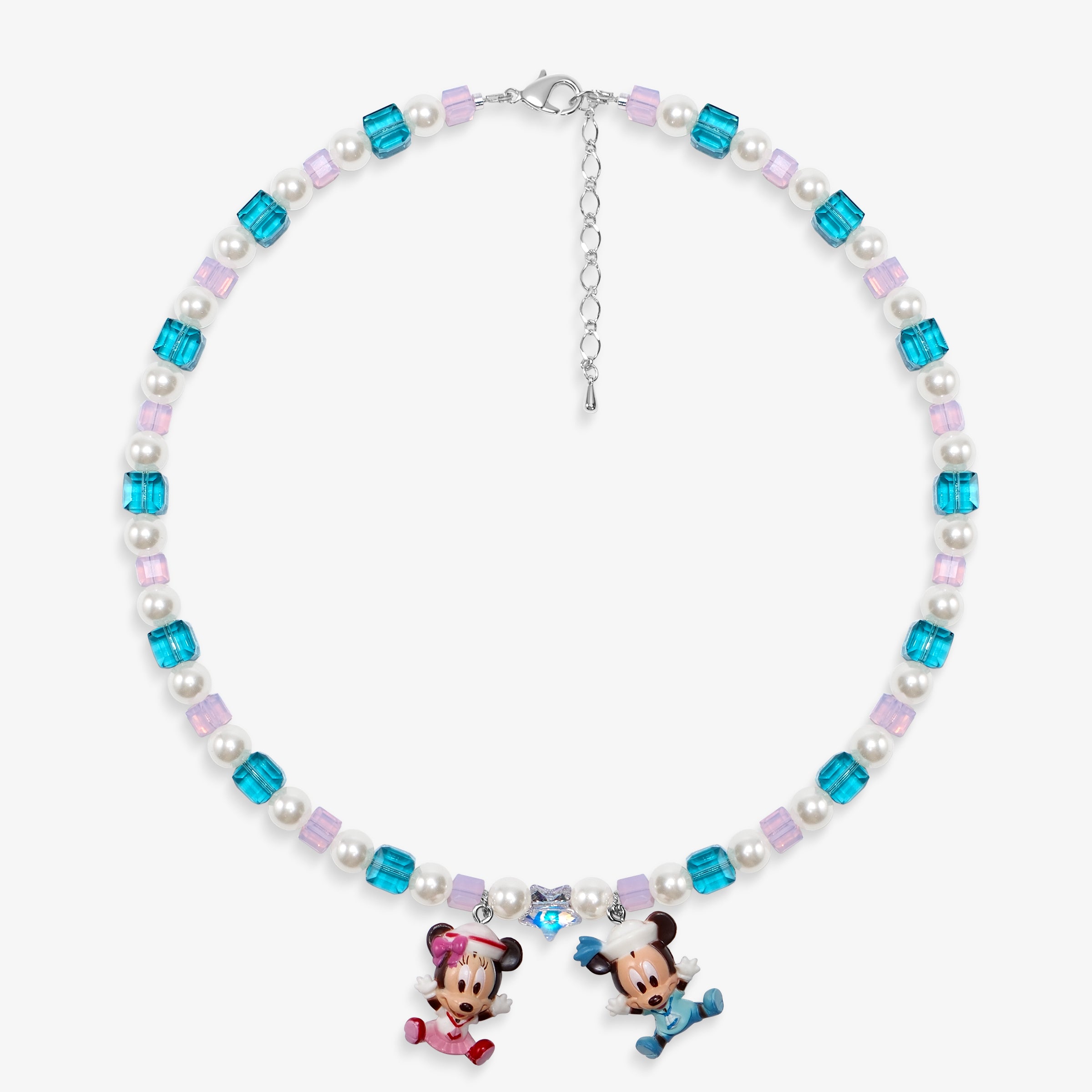 Close-up of a handmade pastel Swarovski crystal charm necklace with crystals, pearls and nostalgic vintage-inspired collectible charm details