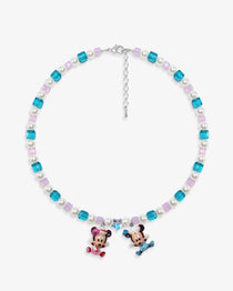 Close-up of a handmade pastel Swarovski crystal charm necklace with crystals, pearls and nostalgic vintage-inspired collectible charm details