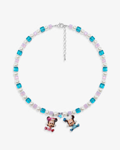 Close-up of a handmade pastel Swarovski crystal charm necklace with crystals, pearls and nostalgic vintage-inspired collectible charm details