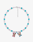 Close-up of a handmade pastel Swarovski crystal charm necklace with crystals, pearls and nostalgic vintage-inspired collectible charm details