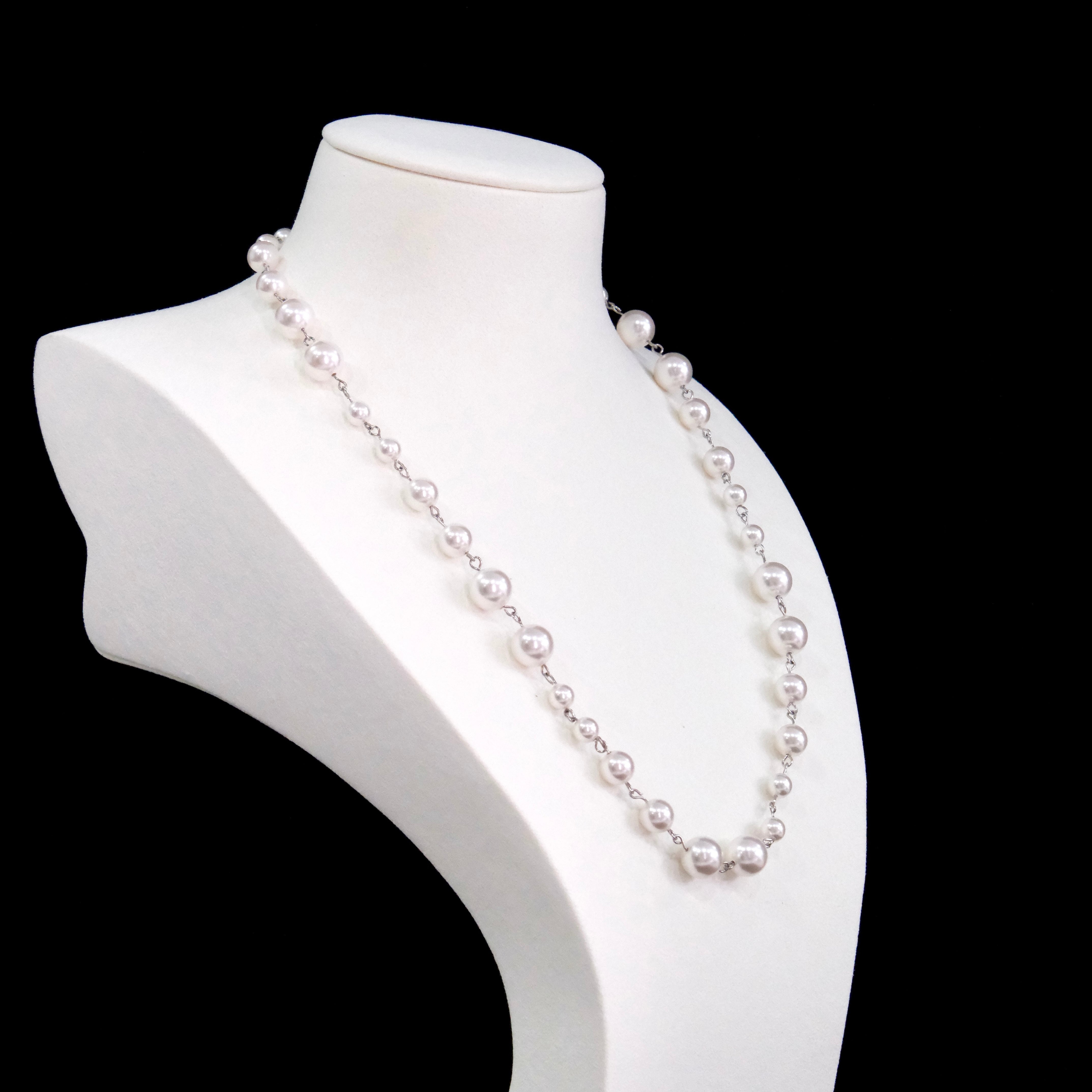 Close-up of a handmade Swarovski crystal and pearl necklace with crystals, pearls and clean pearl styling details
