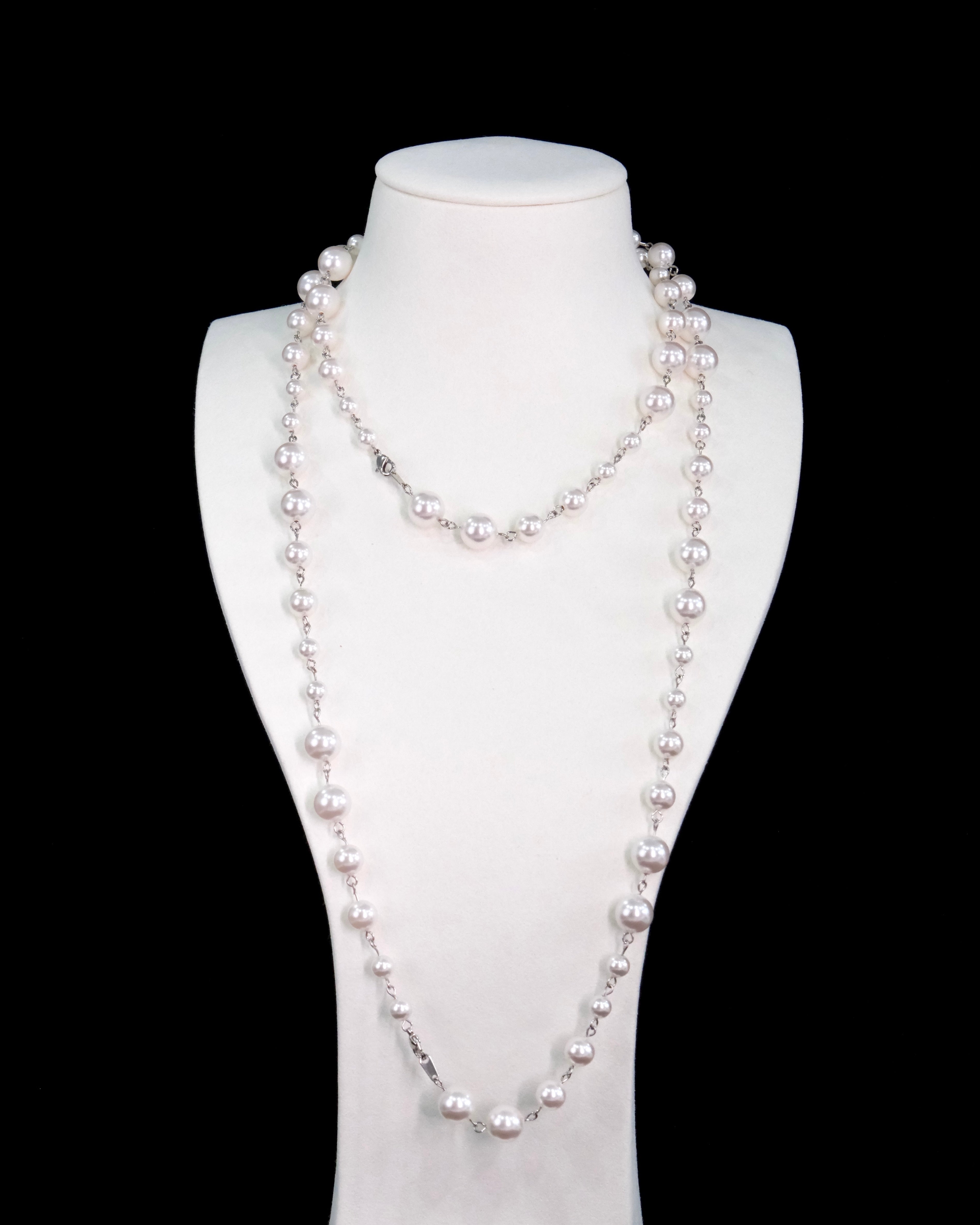 Close-up of a handmade Swarovski crystal and pearl necklace with crystals, pearls and clean pearl styling details