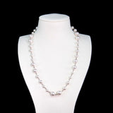 Close-up of a handmade Swarovski crystal and pearl necklace with crystals, pearls and clean pearl styling details