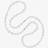 Flat lay of a handmade Swarovski crystal and pearl necklace with crystals, pearls and clean pearl styling details