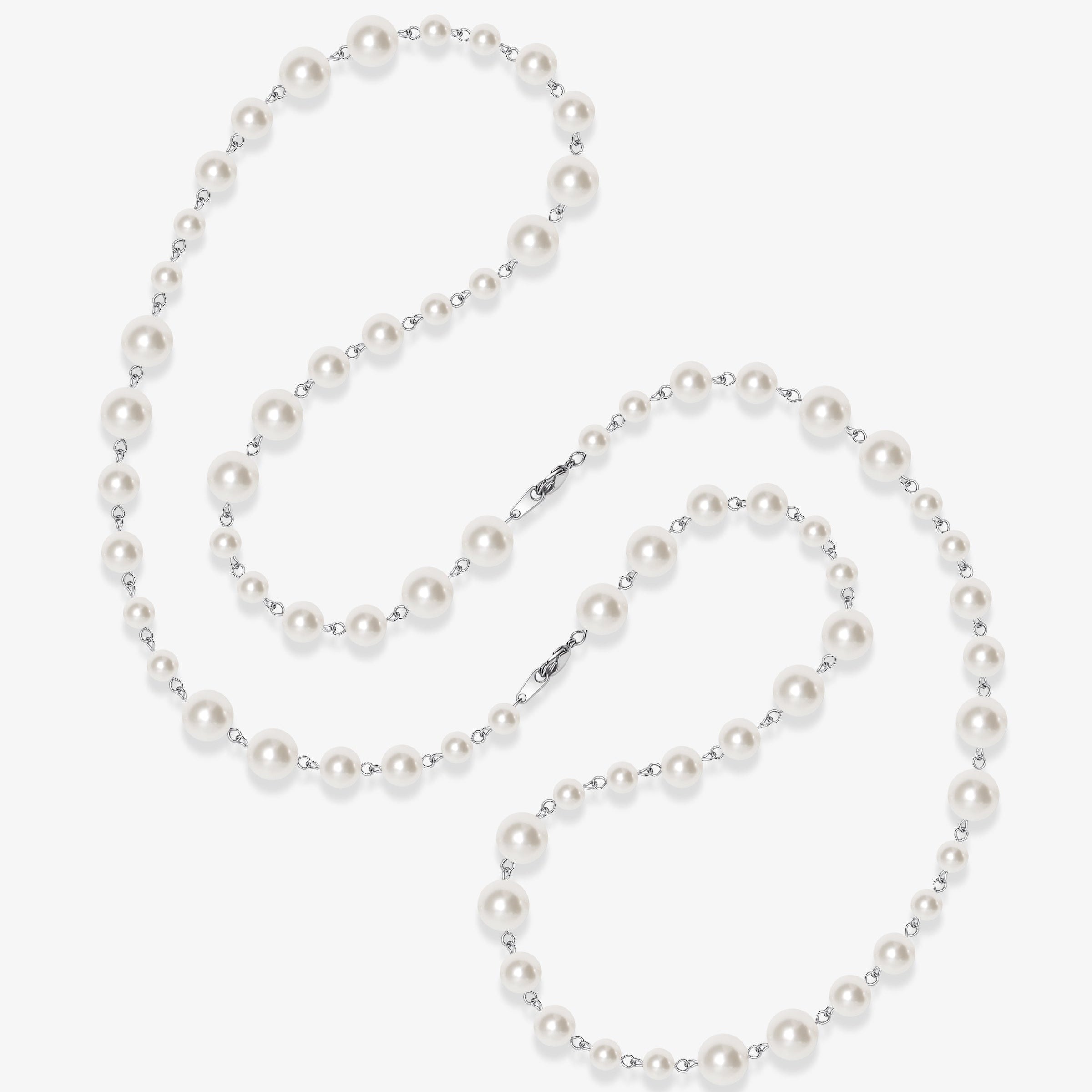 Flat lay of a handmade Swarovski crystal and pearl necklace with crystals, pearls and clean pearl styling details