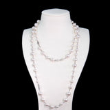 Model wearing a handmade Swarovski crystal and pearl necklace with crystals, pearls and clean pearl styling details