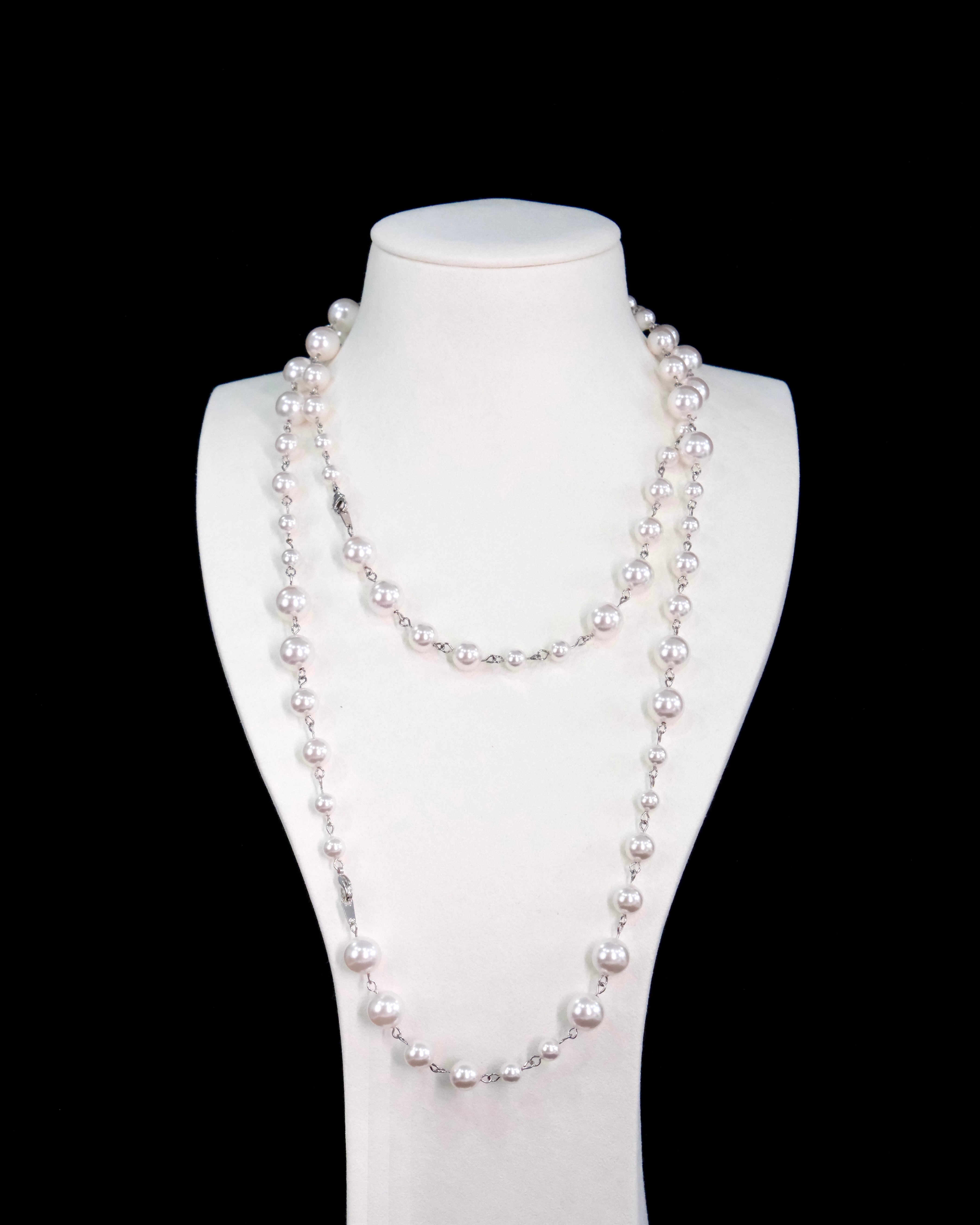 Model wearing a handmade Swarovski crystal and pearl necklace with crystals, pearls and clean pearl styling details
