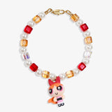 Close-up of a handmade pink Swarovski crystal charm bracelet with crystals, pearls and sweetheart-inspired collectible charm details
