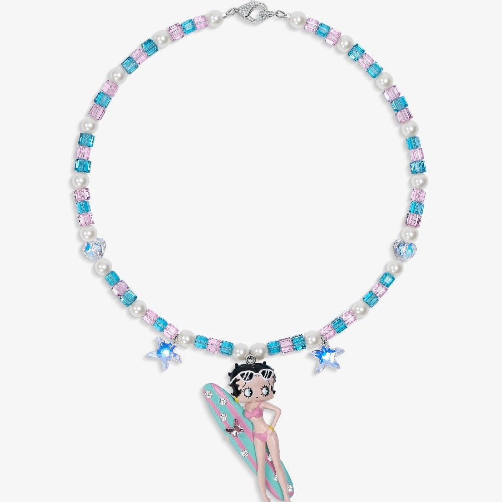 Close-up of a handmade pink Swarovski crystal charm necklace with crystals, pearls and surf-inspired collectible charm details