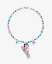 Close-up of a handmade pink Swarovski crystal charm necklace with crystals, pearls and surf-inspired collectible charm details