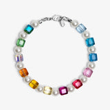 Close-up of a handmade rainbow Swarovski crystal charm bracelet with crystals, pearls and rainbow-inspired collectible charm details