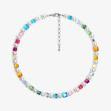 Close-up of a handmade rainbow Swarovski crystal charm necklace with crystals, pearls and rainbow-inspired collectible charm details