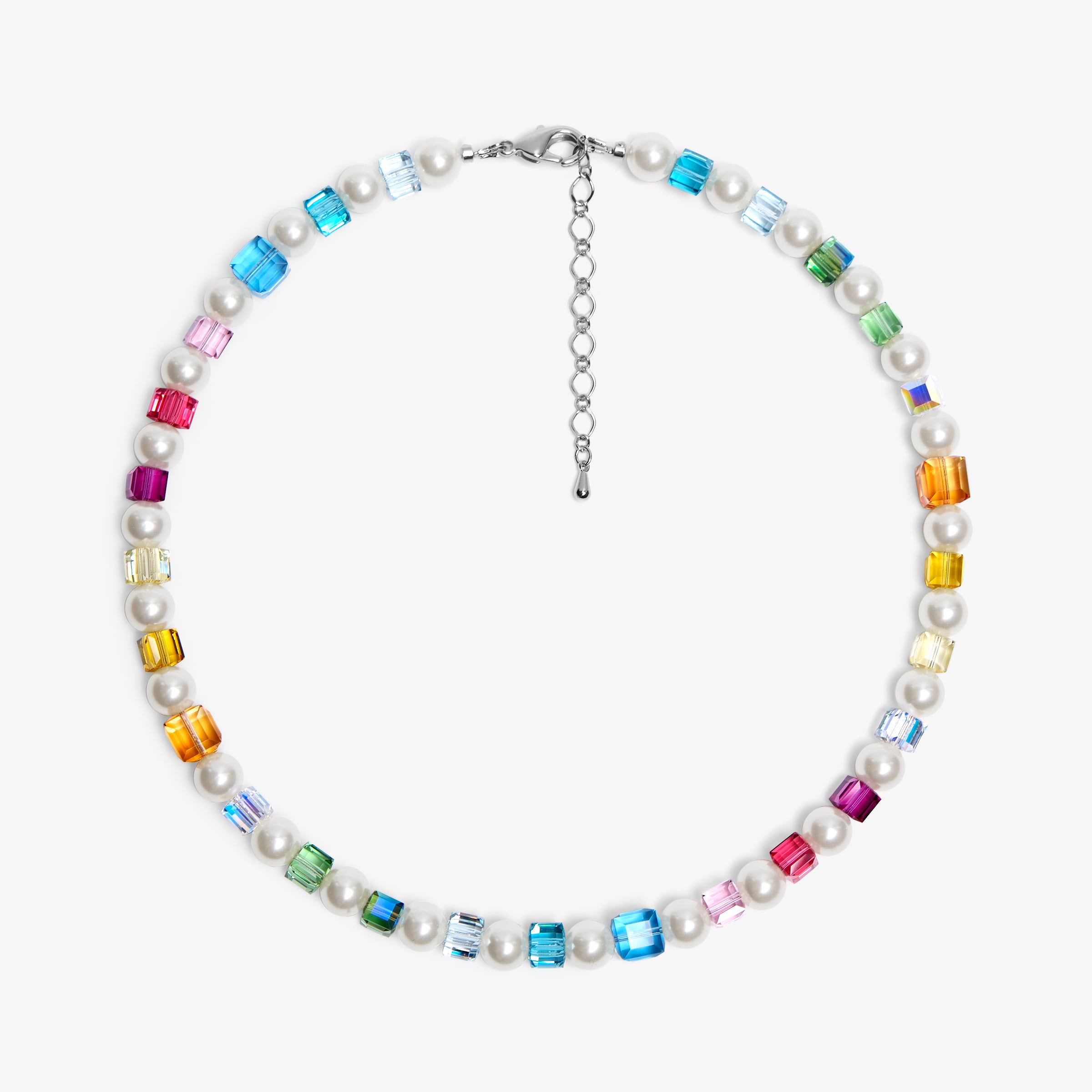 Close-up of a handmade rainbow Swarovski crystal charm necklace with crystals, pearls and rainbow-inspired collectible charm details