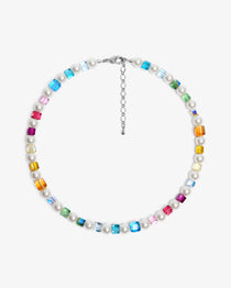 Close-up of a handmade rainbow Swarovski crystal charm necklace with crystals, pearls and rainbow-inspired collectible charm details