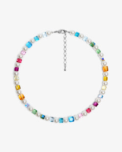 Close-up of a handmade rainbow Swarovski crystal charm necklace with crystals, pearls and rainbow-inspired collectible charm details