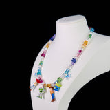 Close-up of a handmade rainbow Swarovski crystal charm necklace with crystals, pearls and rainbow-inspired collectible charm details