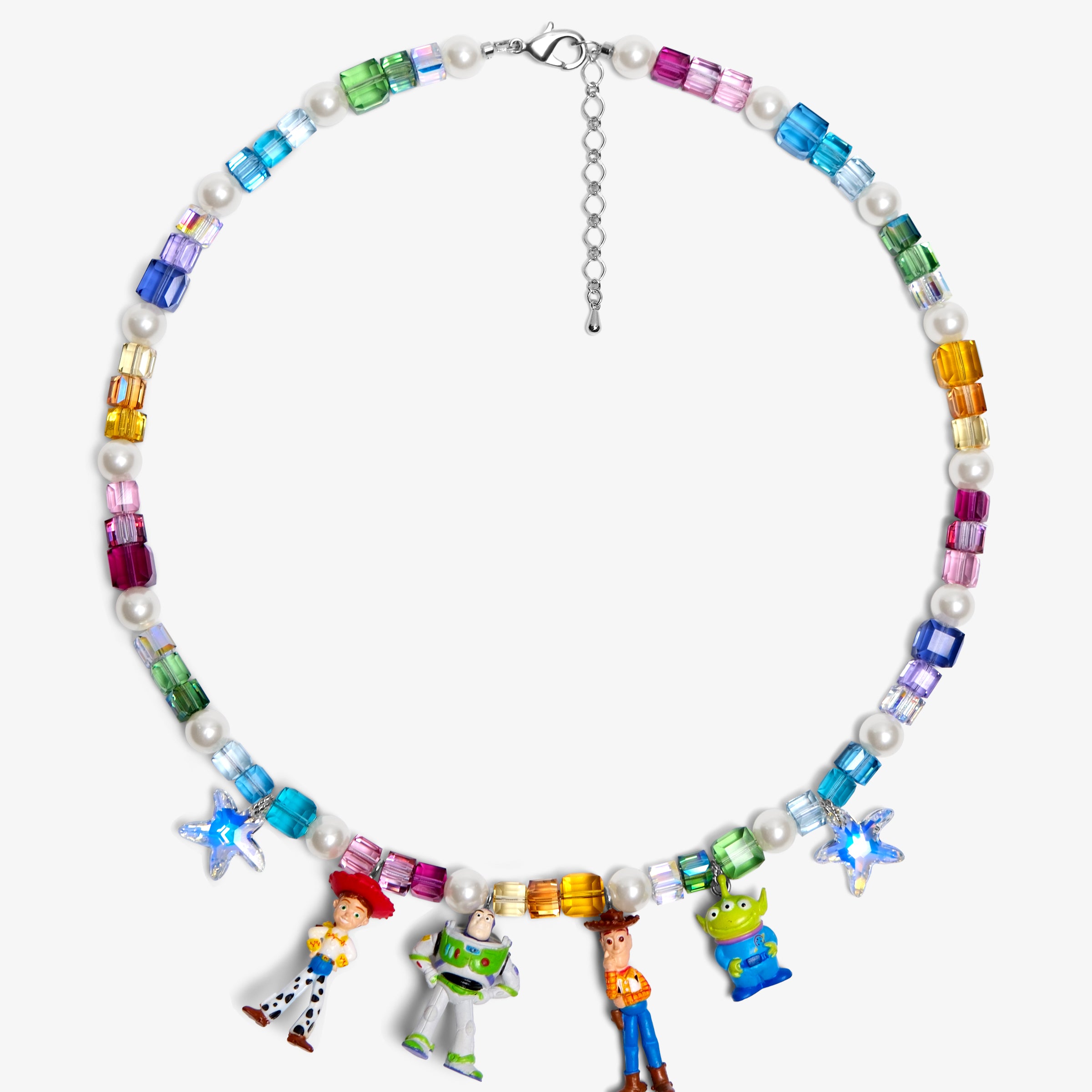 Flat lay of a handmade rainbow Swarovski crystal charm necklace with crystals, pearls and rainbow-inspired collectible charm details