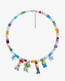 Flat lay of a handmade rainbow Swarovski crystal charm necklace with crystals, pearls and rainbow-inspired collectible charm details