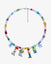 Flat lay of a handmade rainbow Swarovski crystal charm necklace with crystals, pearls and rainbow-inspired collectible charm details