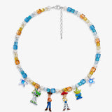 Flat lay of a handmade Swarovski crystal charm necklace with crystals, pearls and rainbow-inspired collectible charm details